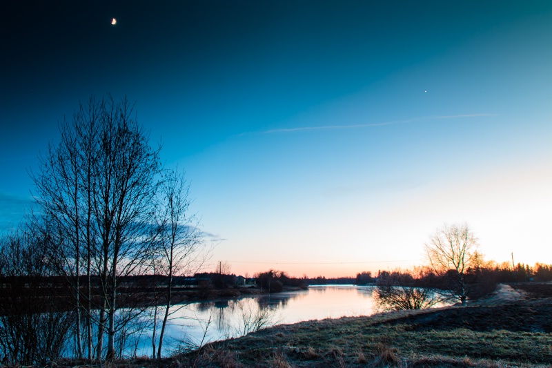 Moon And Sunset At The River