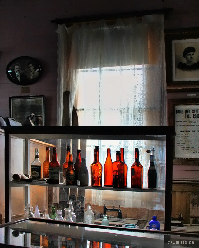 Old Bottles in a Window