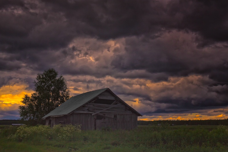 Abandoned Barn House Under The Storm Clouds