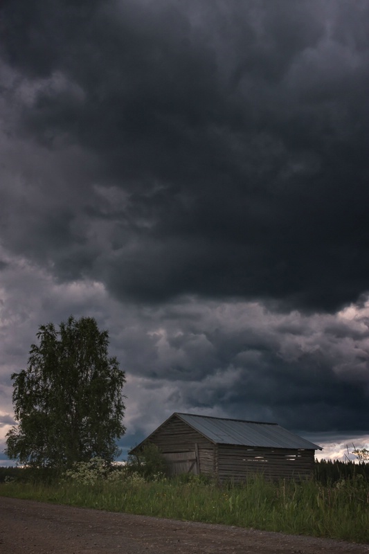 Small Barn Under The Storm Clouds
