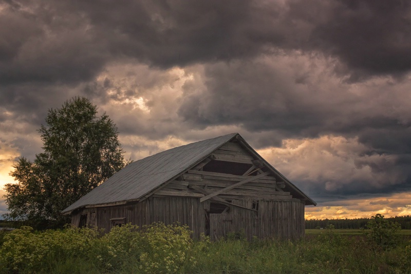 Stormy Clouds Over The Barn House