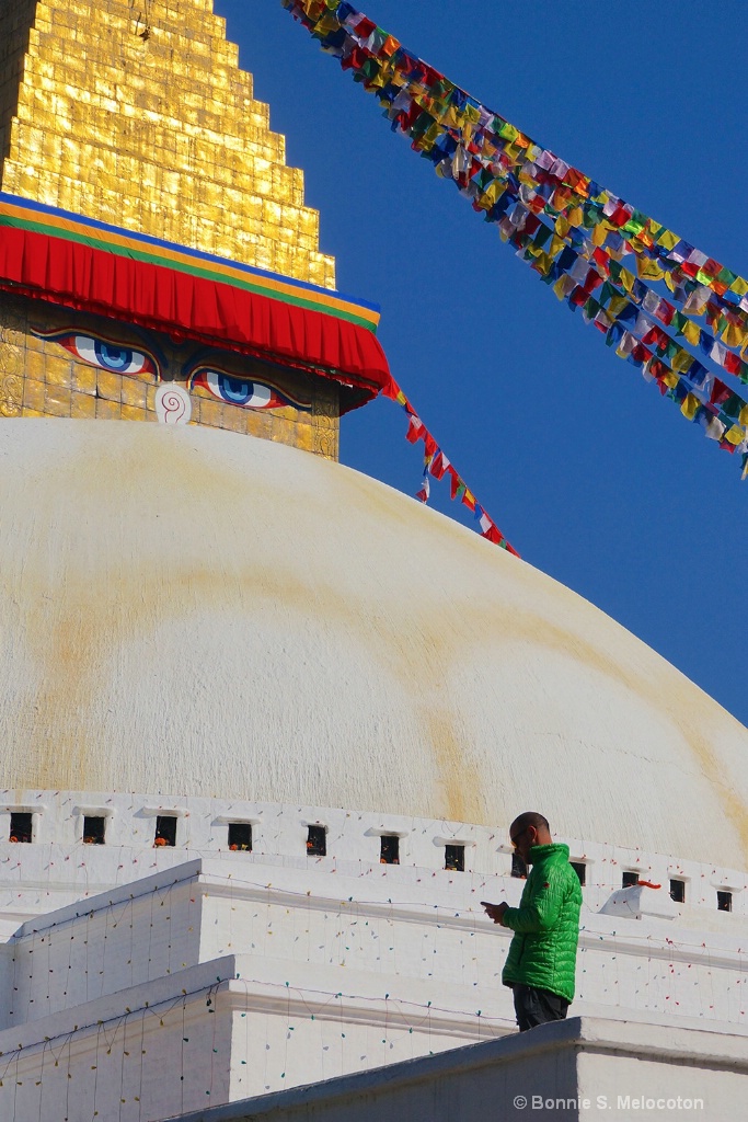 Texting under the watchful eyes of Buddha 