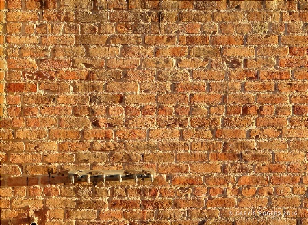 A Metal Thing on an Old Brick Wall