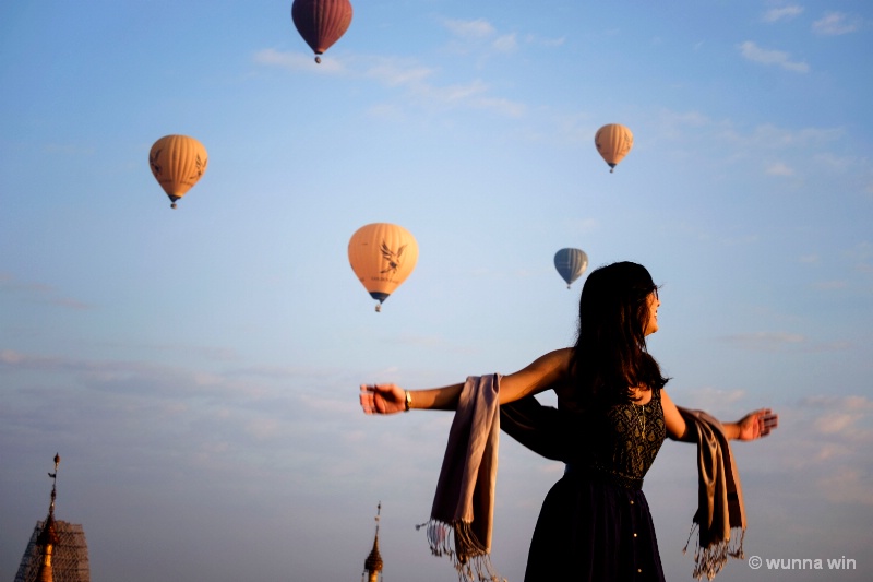 a girl with balloons 