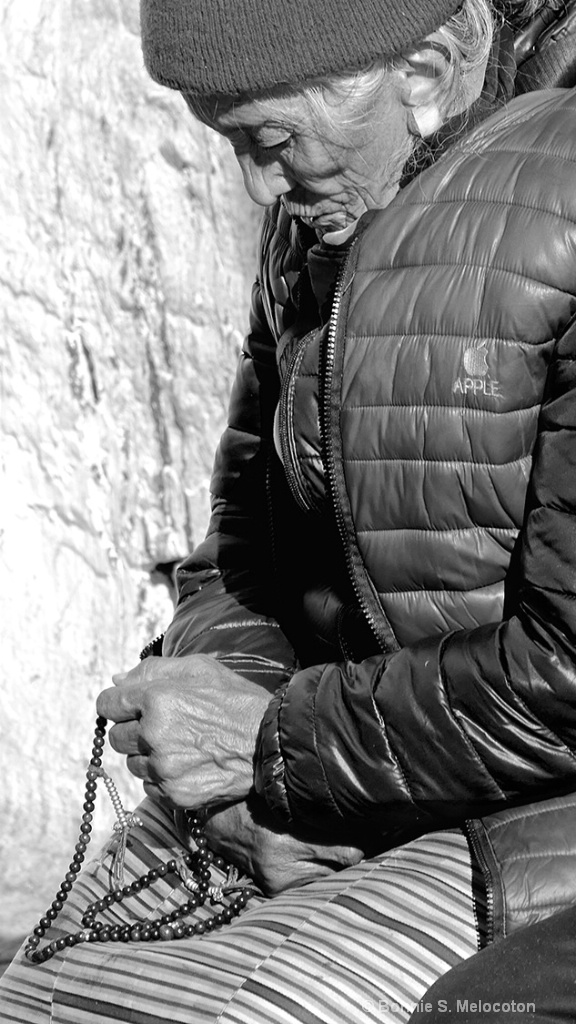 A Tibetan Woman With Her Prayer Beads