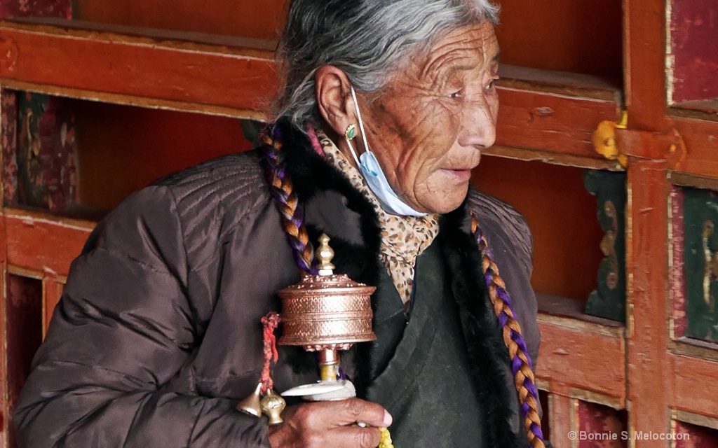 A Tibetan Woman With Her Prayer Wheel