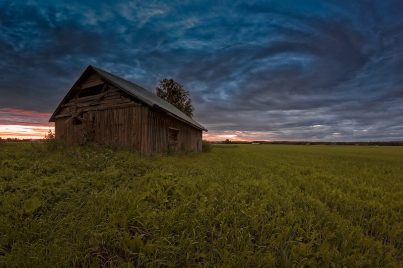 Old Barn House Under The Dramatic Summer Skie