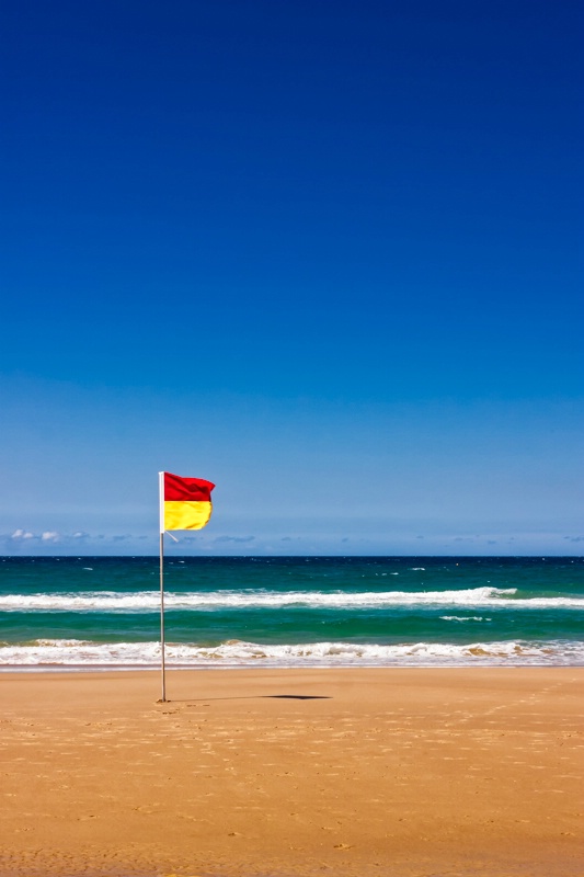 Lonely Life Saver Flag On Australian Beach