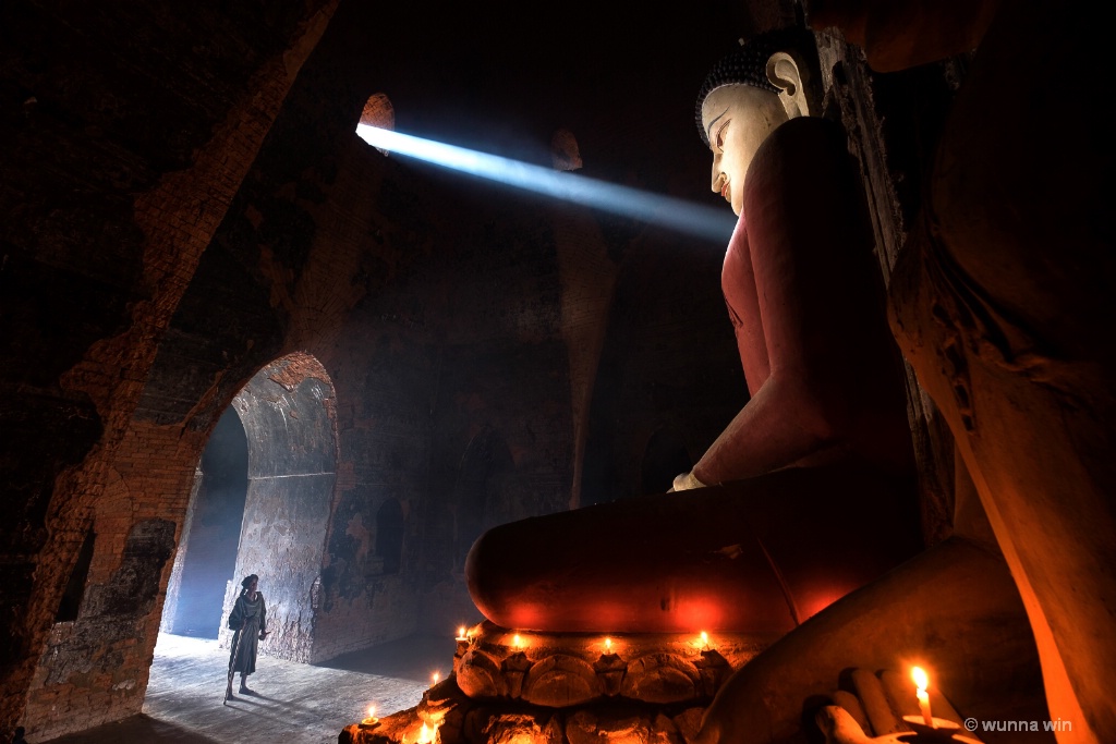 Buddha statue with rays of light
