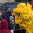 2Lion Dancers and Somewhat Hesitant Young Fans - ID: 15523613 © John Tubbs