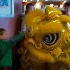2Lion Dancer and Young Fan - ID: 15523614 © John Tubbs