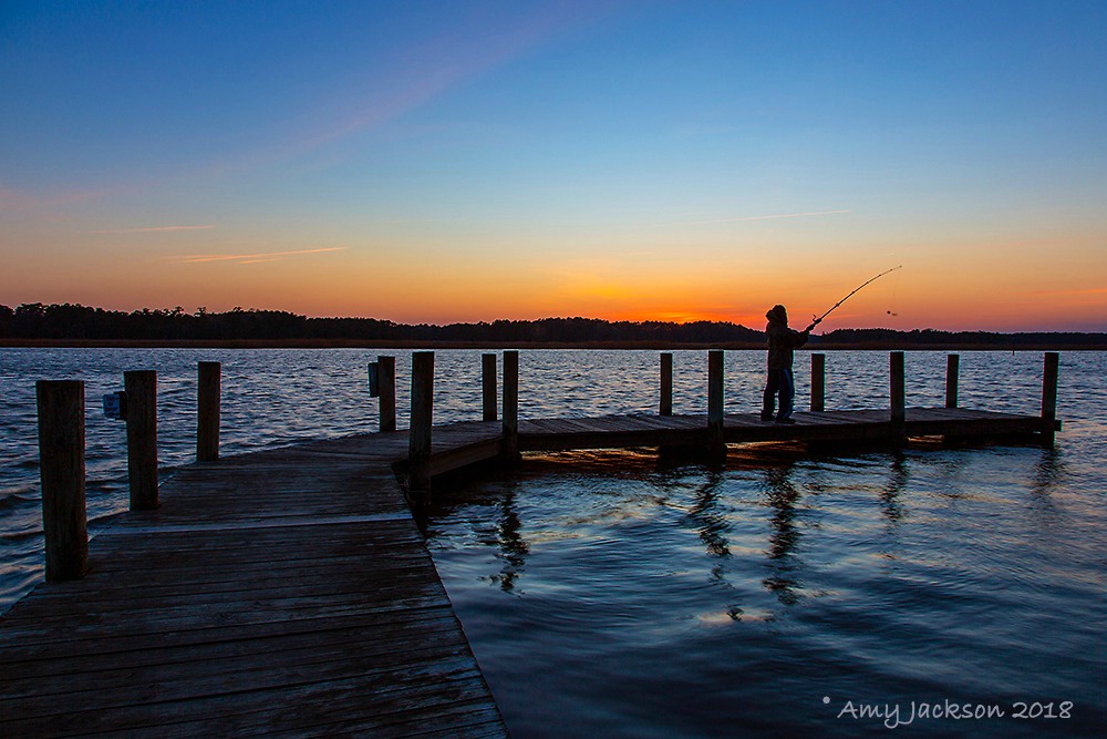 Man Fishing at Sunset