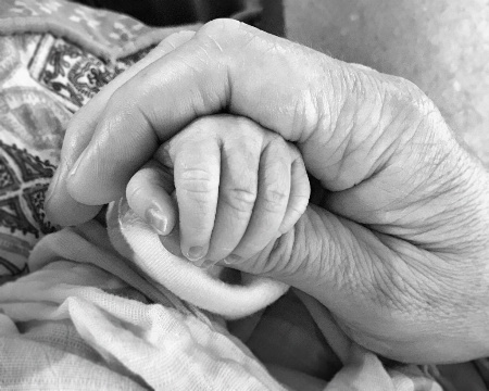 Holding Grandpa's Hand for the First Time