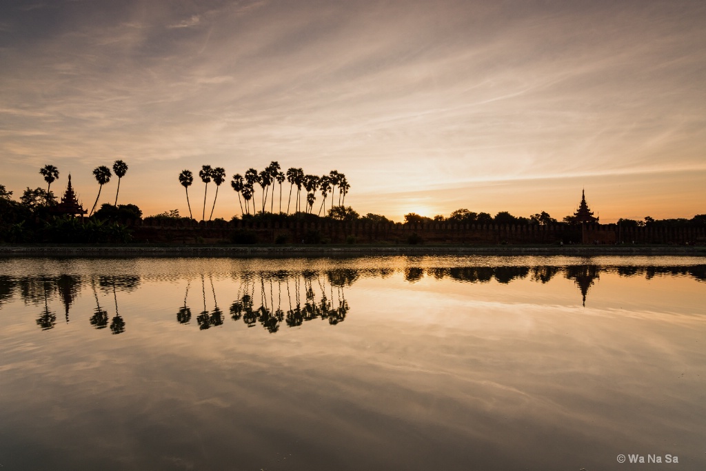 Sunrise over Mandalay moat.