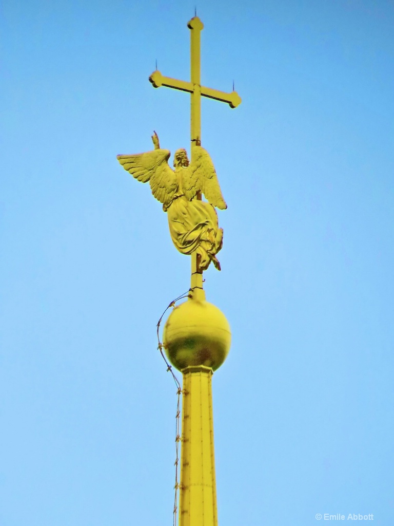 Angel holding cross