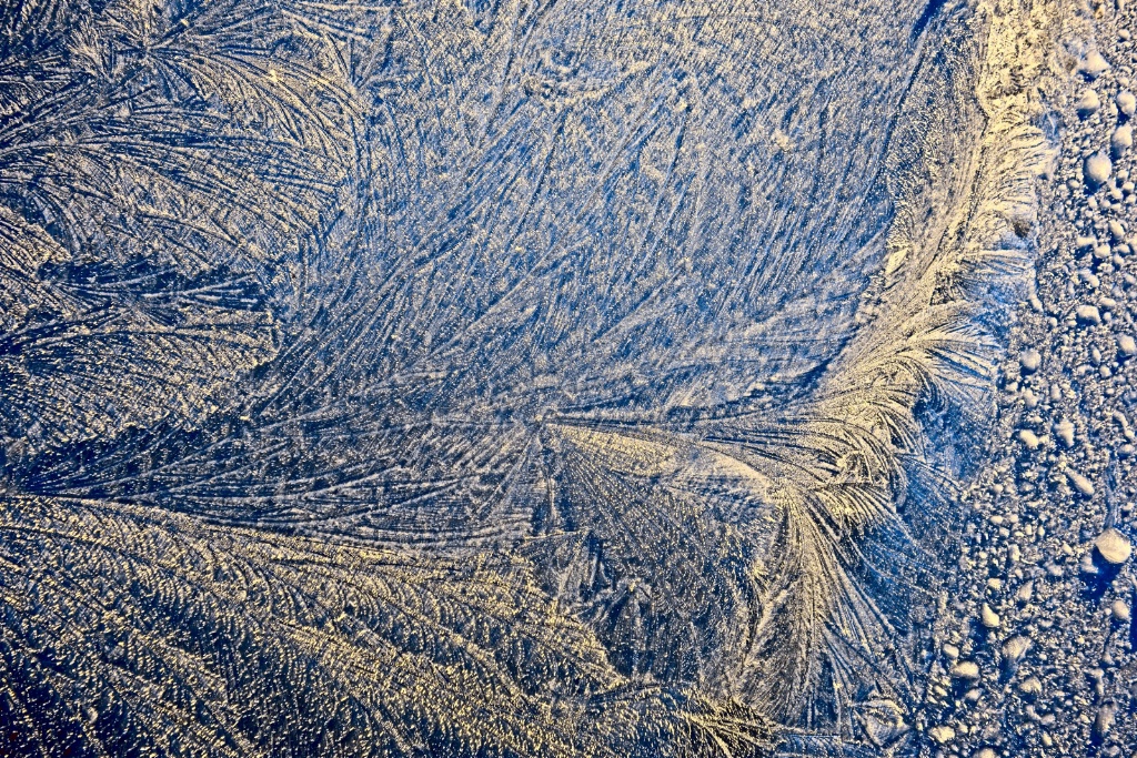 Icy formation on metal surface.