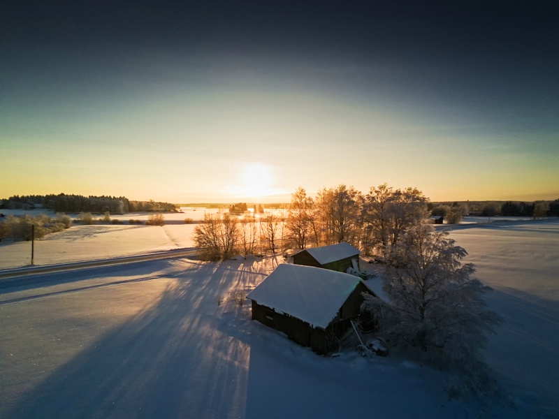 Farm Houses In The Winter Sunset