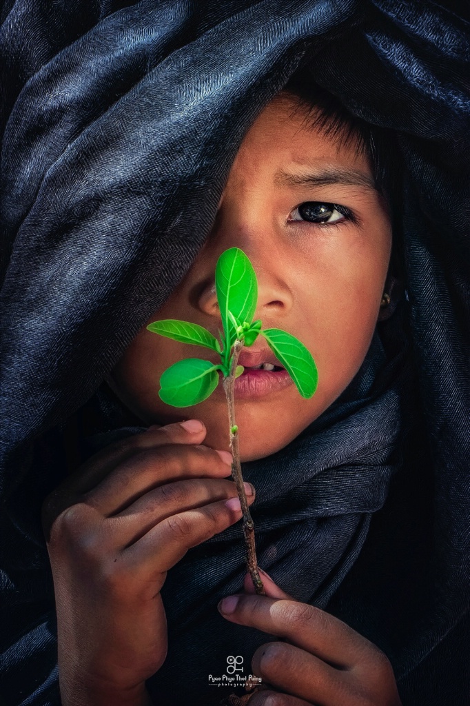 Child and a flower