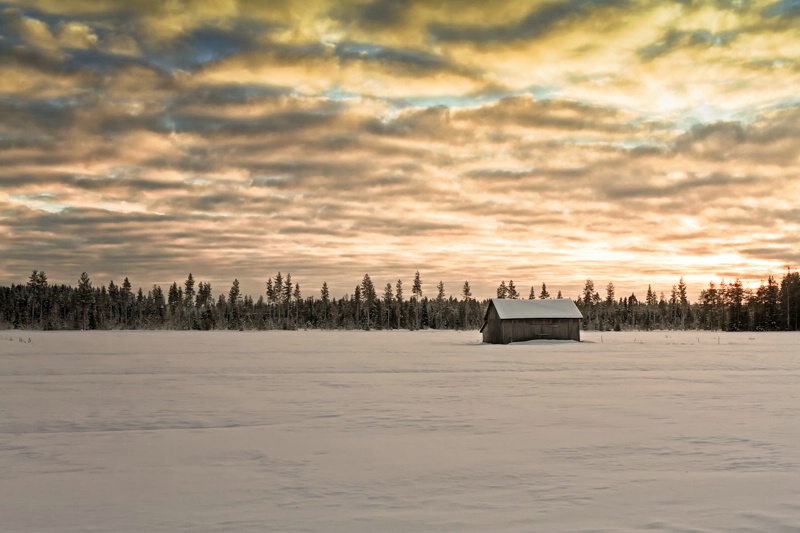 Sunset Over The Snow Covered Fields