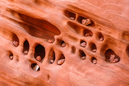 a slot canyon wall of small stones